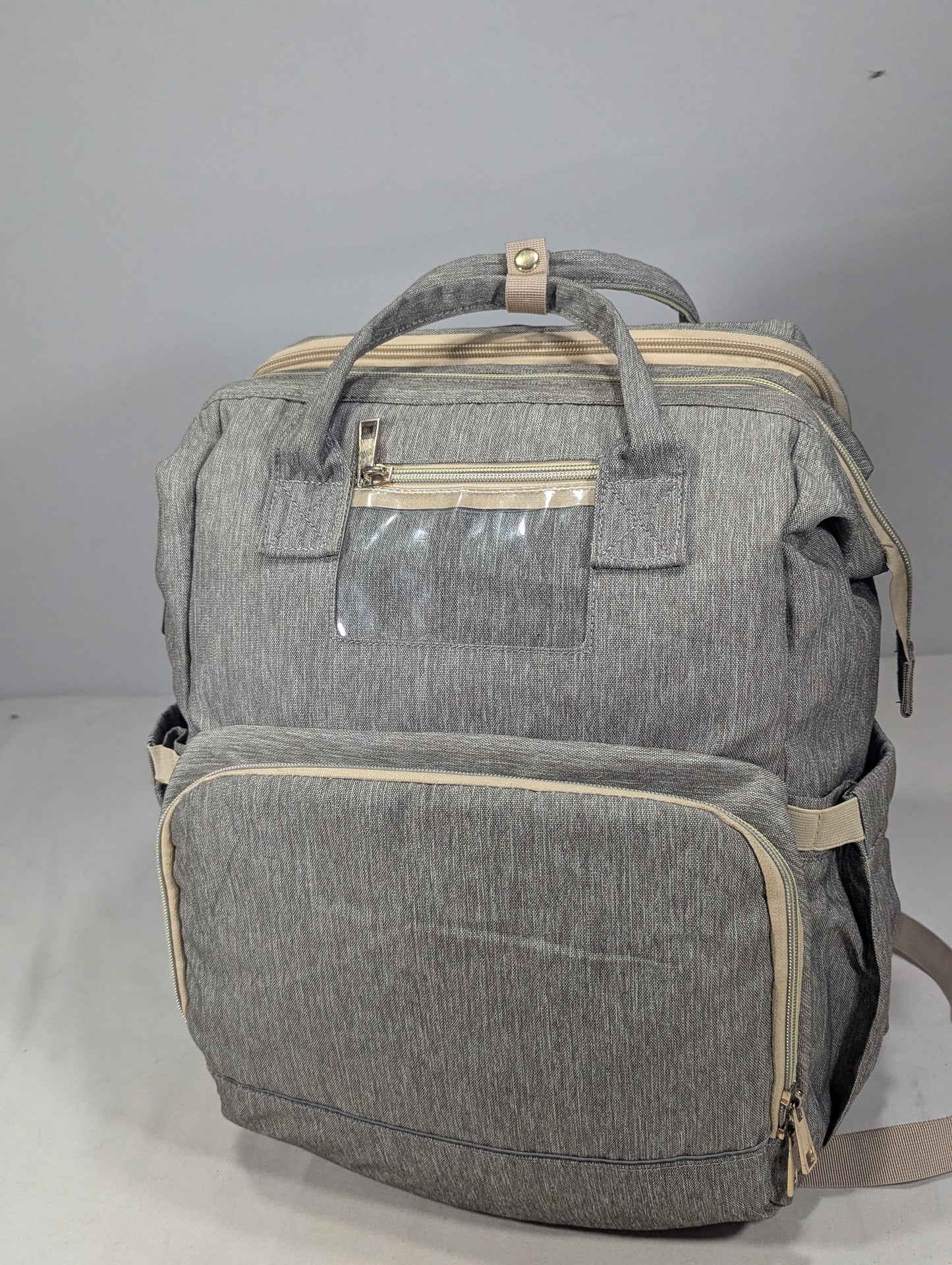 Grey color baby diaper backpack with bed