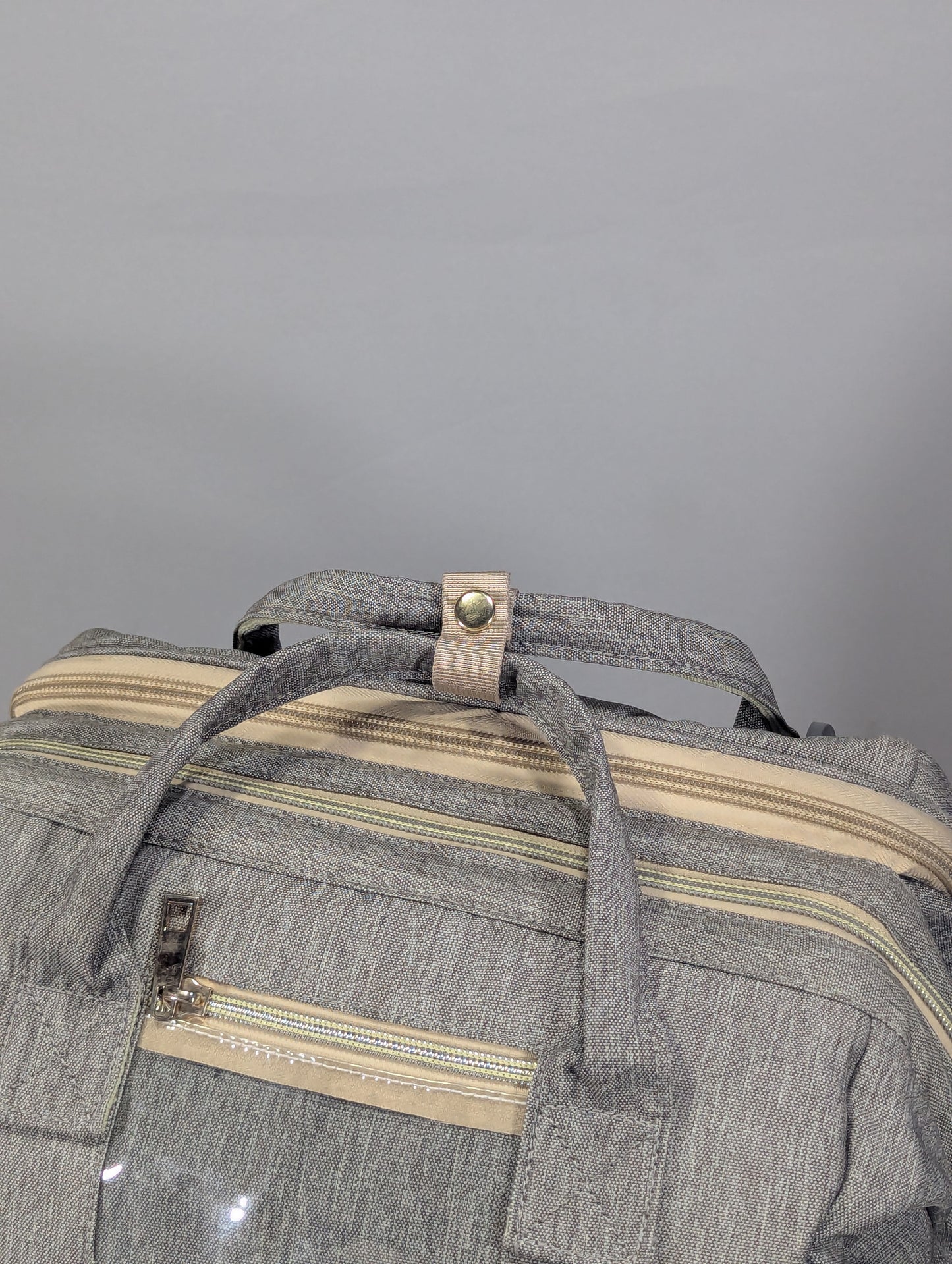 Grey color baby diaper backpack with bed