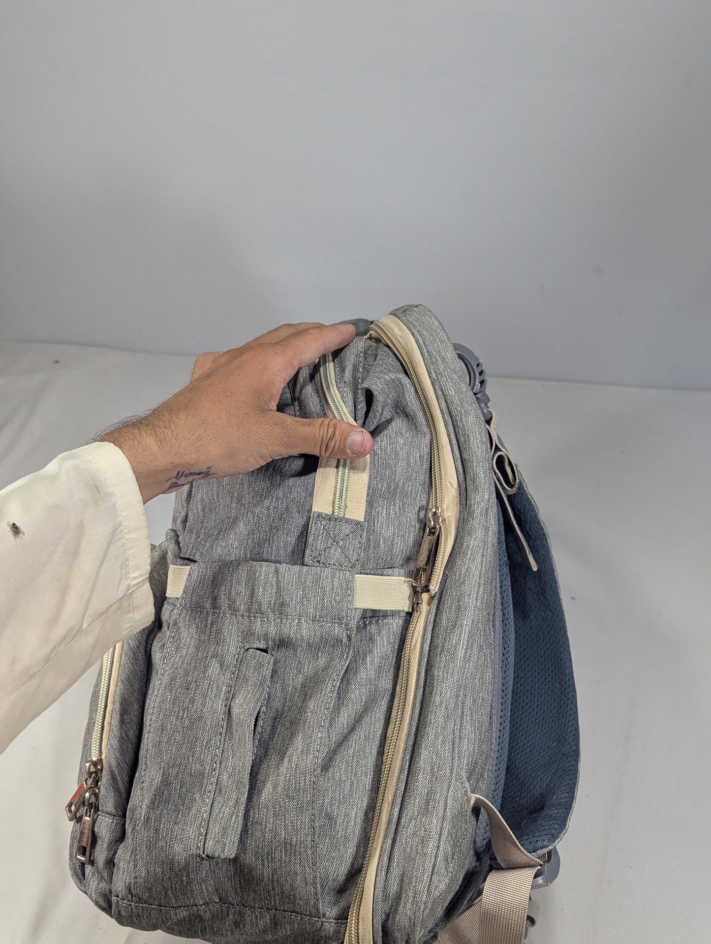 Grey color baby diaper backpack with bed