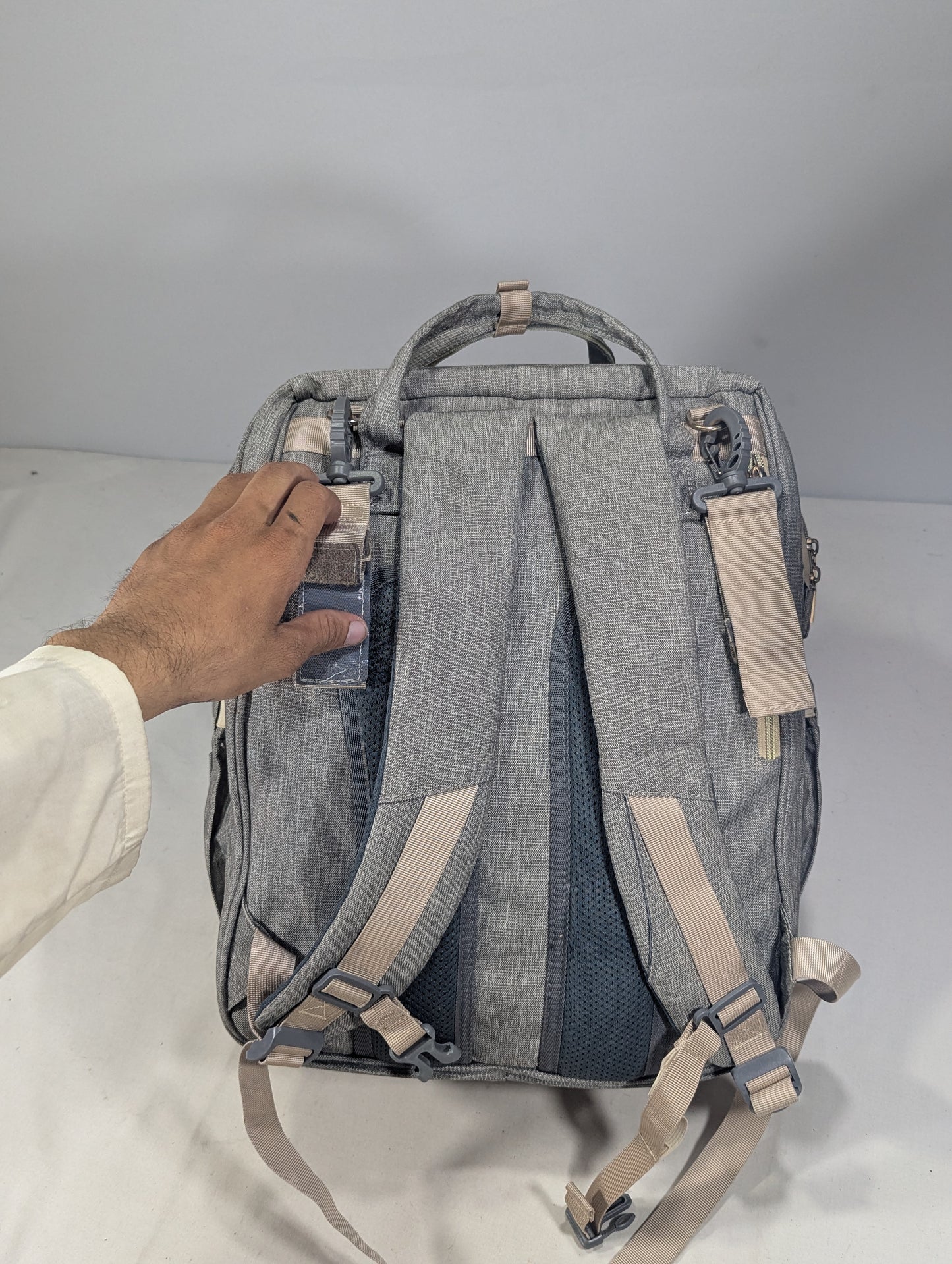 Grey color baby diaper backpack with bed