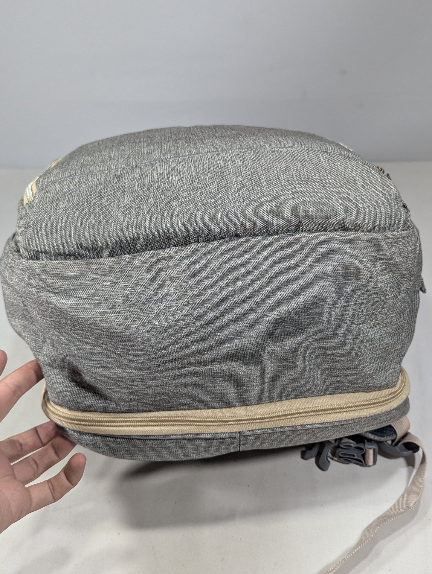 Grey color baby diaper backpack with bed