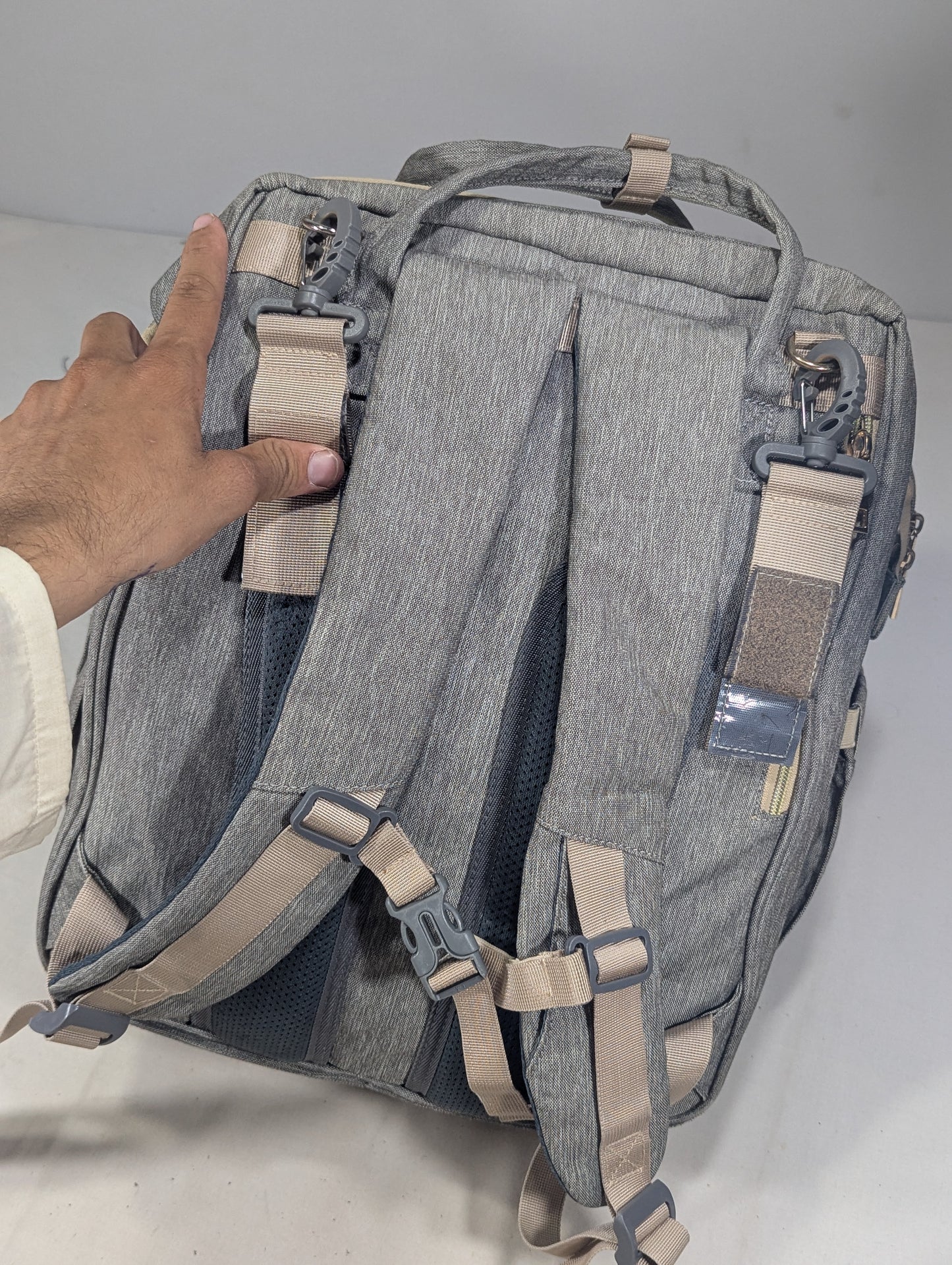 Grey color baby diaper backpack with bed