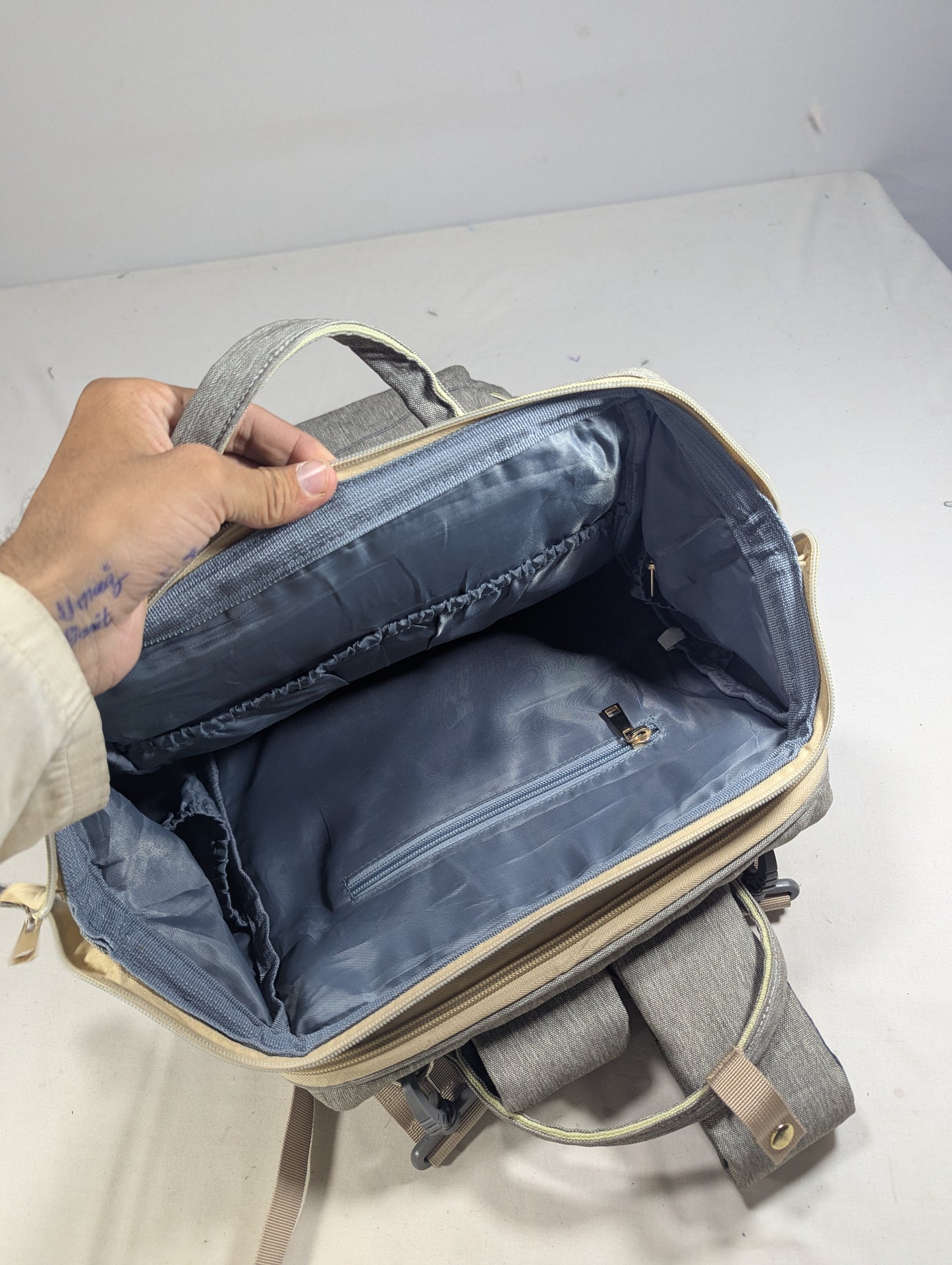 Grey color baby diaper backpack with bed