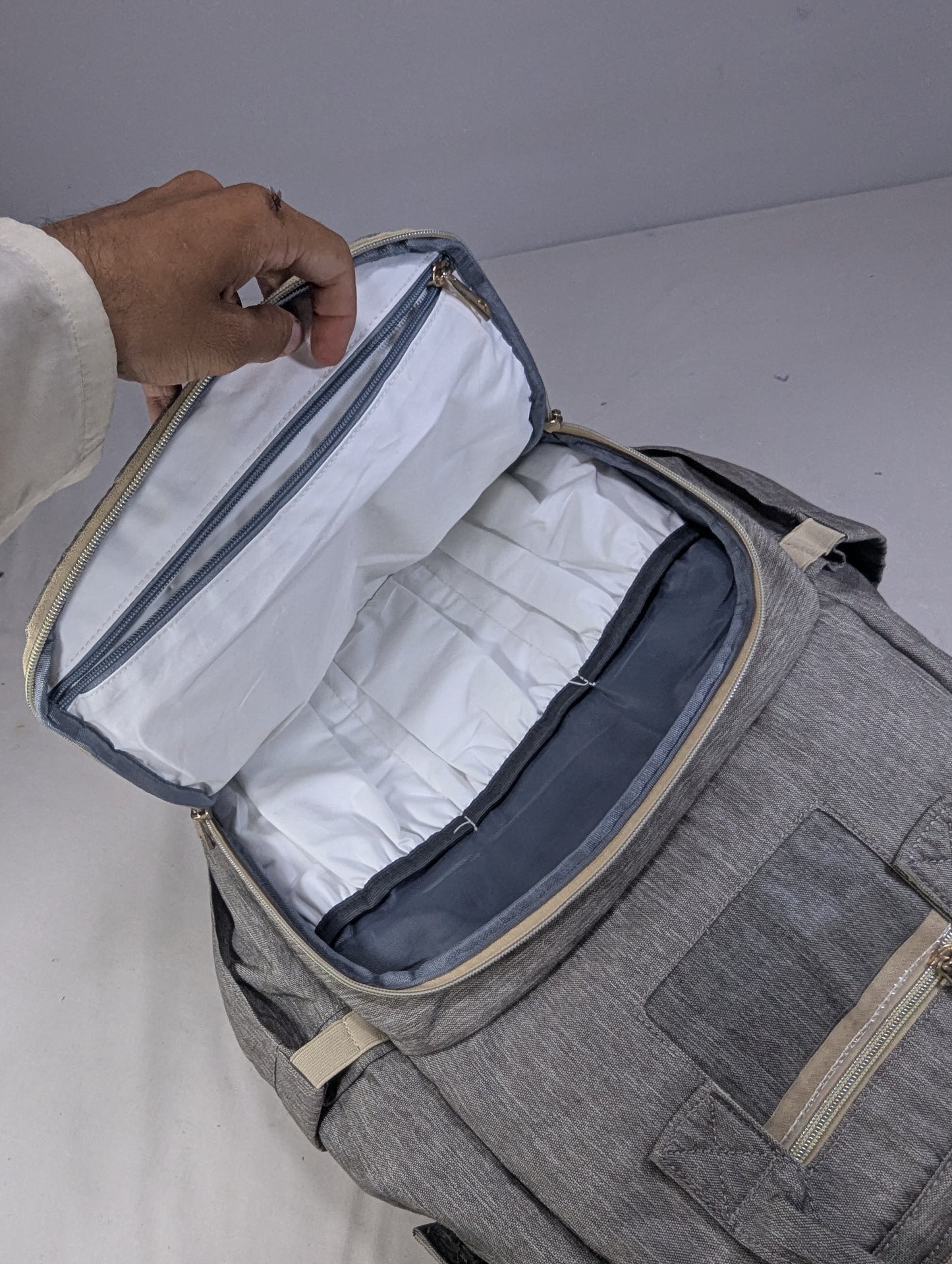 Grey color baby diaper backpack with bed