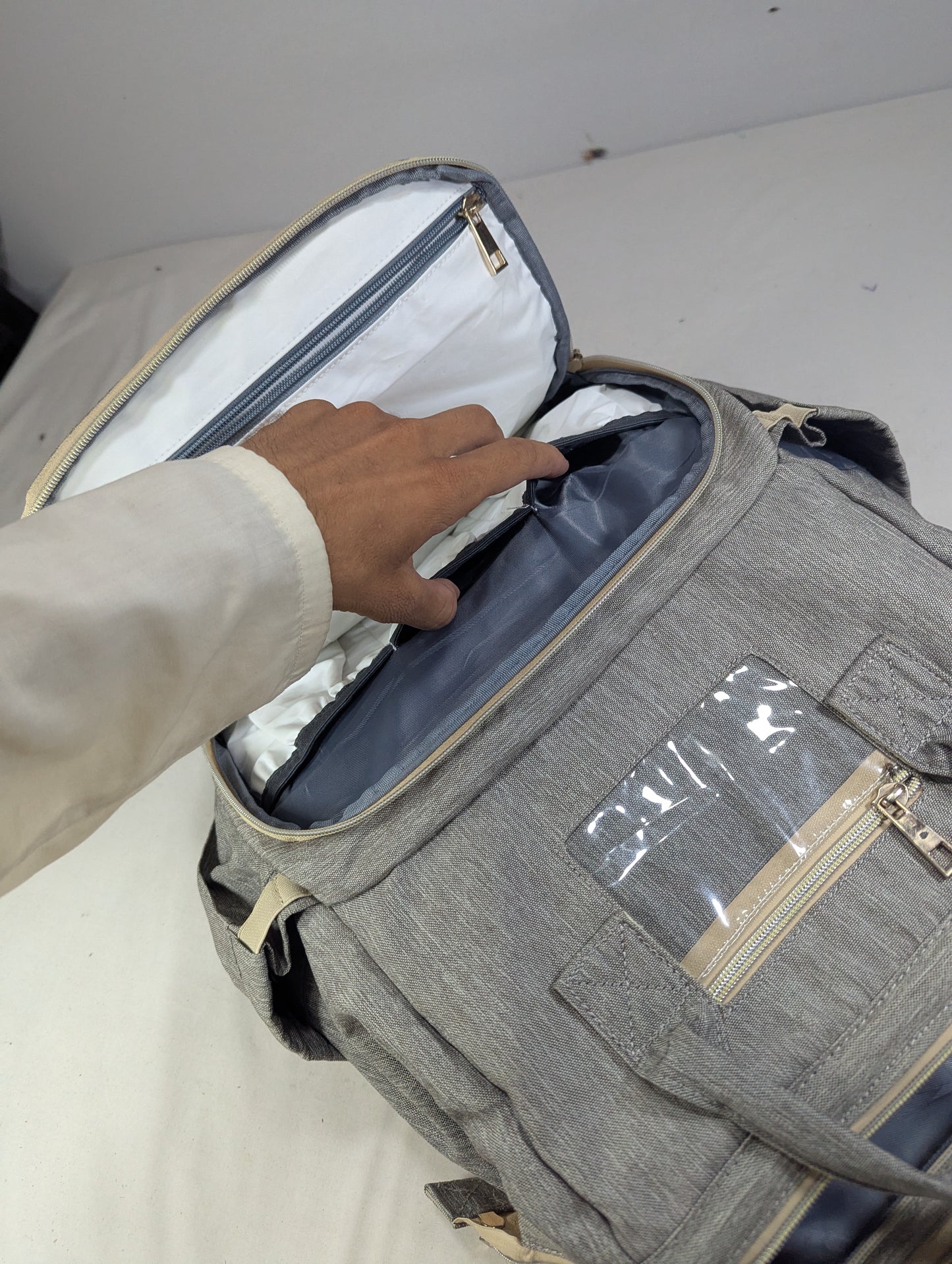 Grey color baby diaper backpack with bed