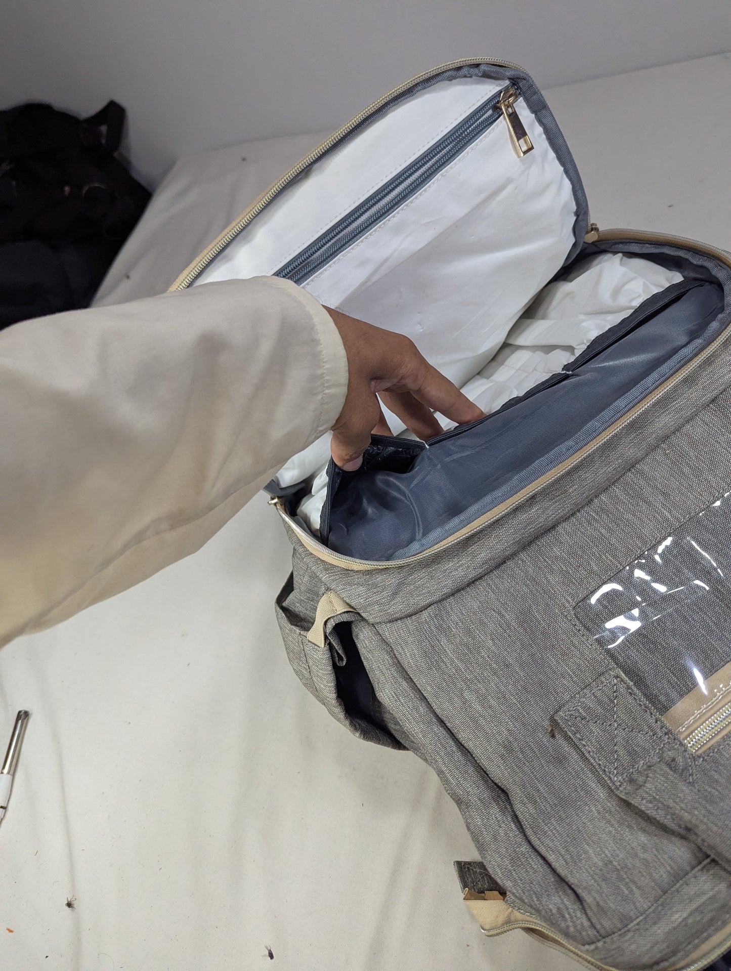 Grey color baby diaper backpack with bed